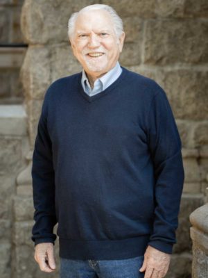 David Shean standing in front of a brick wall