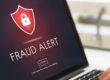 Laptop with Fraud Alert on the screen