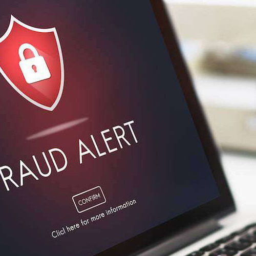 Laptop with Fraud Alert on the screen