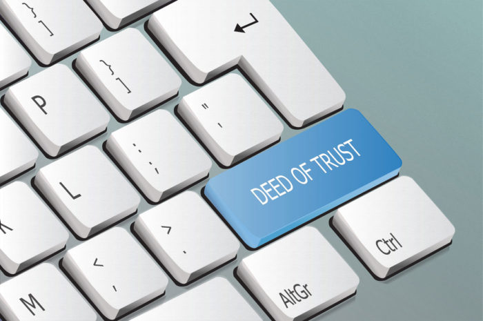 Deed of Trust written on a keyboard button
