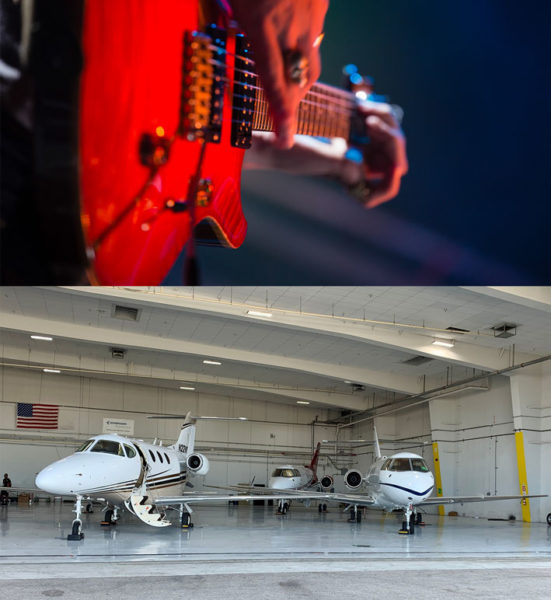 Close up of a person playing a guitar and three private jets in an airplane hanger.
